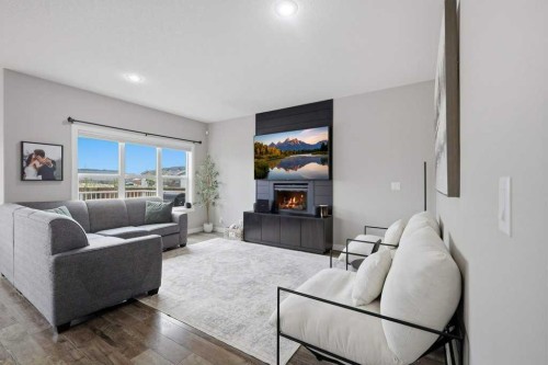 3 Craig Road, Sylvan Lake, AB - Indoor Photo Showing Living Room With Fireplace