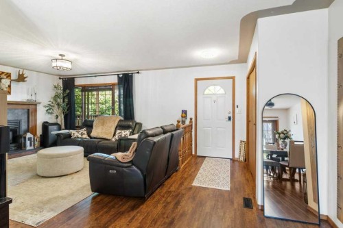 2206 25 Avenue, Delburne, AB - Indoor Photo Showing Living Room With Fireplace