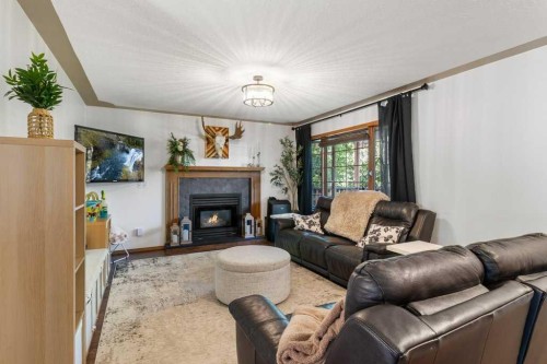 2206 25 Avenue, Delburne, AB - Indoor Photo Showing Living Room With Fireplace