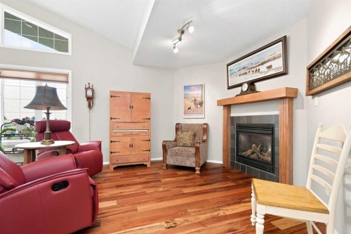 2 Pheasantback Close, Stettler, AB - Indoor Photo Showing Living Room With Fireplace
