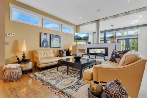31 Leaside Crescent, Sylvan Lake, AB - Indoor Photo Showing Living Room With Fireplace