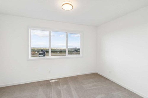 69 Bluerock Hill Sw, Calgary, AB 