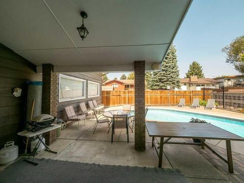 3721 Oak Drive South, Lethbridge, AB - Outdoor With In Ground Pool With Deck Patio Veranda With Exterior