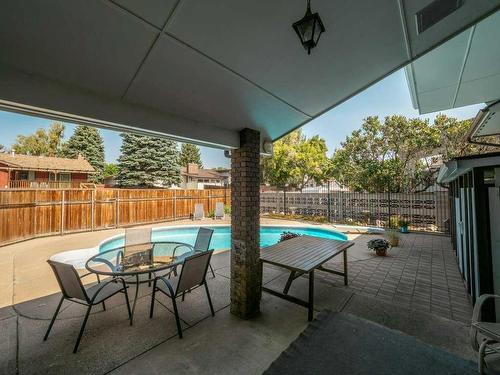 3721 Oak Drive South, Lethbridge, AB - Outdoor With In Ground Pool With Deck Patio Veranda