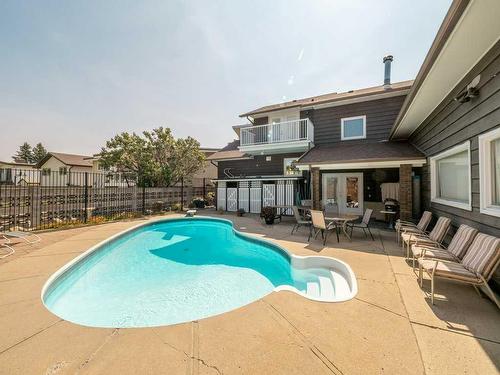3721 Oak Drive South, Lethbridge, AB - Outdoor With In Ground Pool With Deck Patio Veranda With Exterior
