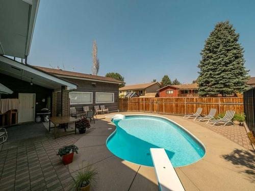 3721 Oak Drive South, Lethbridge, AB - Outdoor With In Ground Pool With Deck Patio Veranda