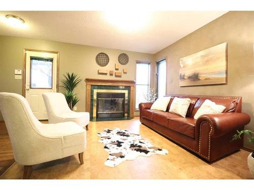 936 13 Street South, Lethbridge, AB - Indoor Photo Showing Living Room With Fireplace