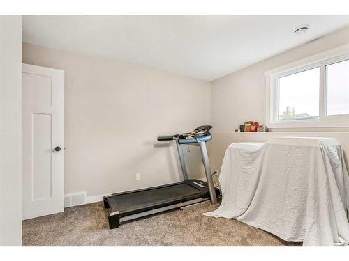 1104 7 Street West, Barnwell, AB - Indoor Photo Showing Gym Room