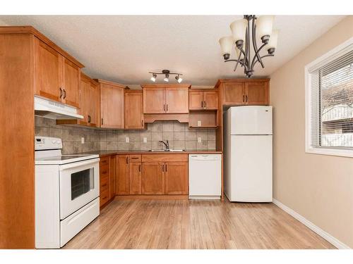 244 Mayor Magrath Drive North, Lethbridge, AB - Indoor Photo Showing Kitchen With Double Sink