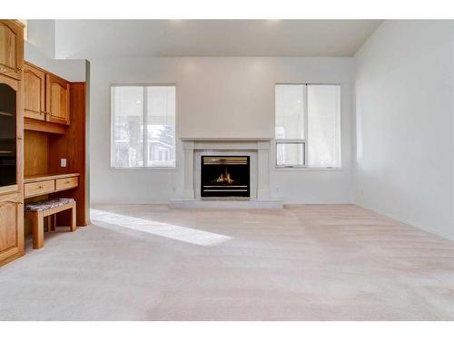 230 Mcmaster Boulevard West, Lethbridge, AB - Indoor Photo Showing Living Room With Fireplace