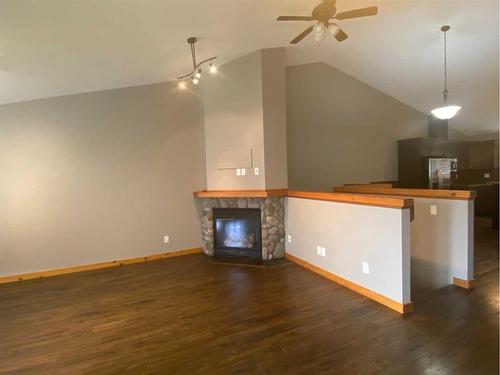 10 Ironstone Drive, Coleman, AB - Indoor With Fireplace
