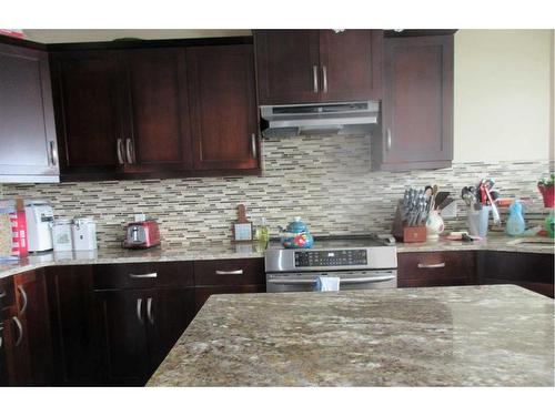 217 Sundance Drive, Coalhurst, AB - Indoor Photo Showing Kitchen With Upgraded Kitchen