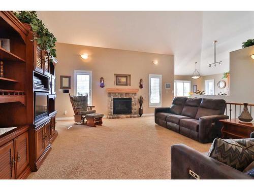 360 E 1 Avenue South, Magrath, AB - Indoor Photo Showing Living Room With Fireplace