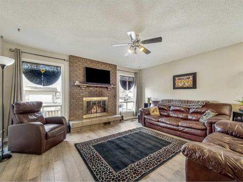 332 Leaside Avenue South, Lethbridge, AB - Indoor Photo Showing Living Room With Fireplace