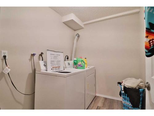 143, 145 7A Avenue West, Cardston, AB - Indoor Photo Showing Laundry Room