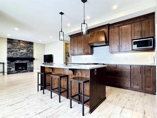 190 Canyon Estates Way West, Lethbridge, AB - Indoor Photo Showing Kitchen With Fireplace