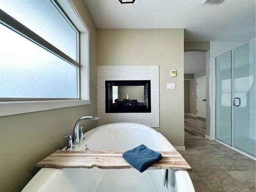 190 Canyon Estates Way West, Lethbridge, AB - Indoor Photo Showing Bathroom With Fireplace