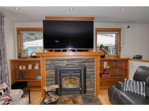 2302 14 Avenue South, Lethbridge, AB - Indoor Photo Showing Living Room With Fireplace
