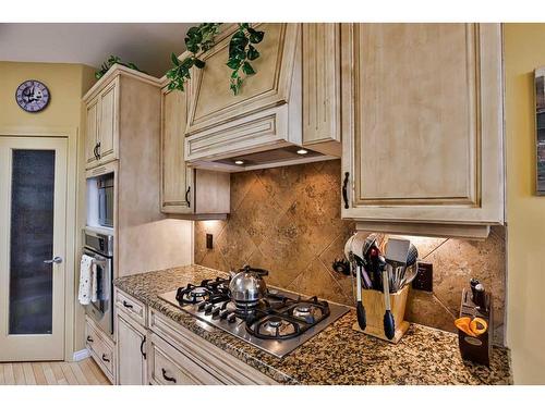 1203 Whispering Greens Place, Vulcan, AB - Indoor Photo Showing Kitchen With Upgraded Kitchen
