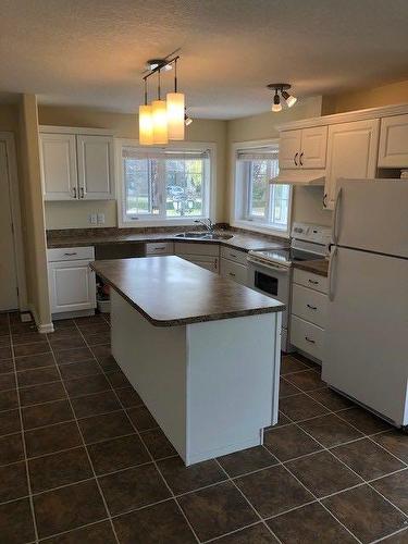 35S 2 Street West, Magrath, AB - Indoor Photo Showing Kitchen With Double Sink