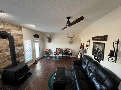 1201 8 Street East, Cardston, AB - Indoor Photo Showing Living Room With Fireplace