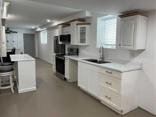 1201 8 Street East, Cardston, AB - Indoor Photo Showing Kitchen With Double Sink
