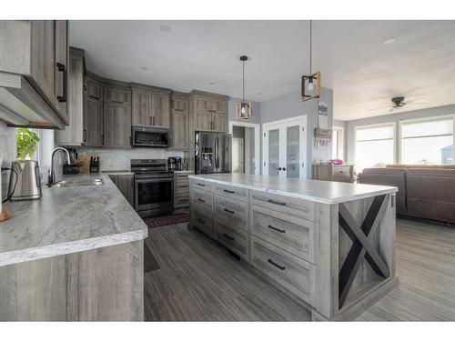 37 Quarry Bank Road, Raymond, AB - Indoor Photo Showing Kitchen With Double Sink