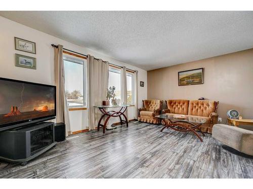 5925 57 Street, Taber, AB - Indoor Photo Showing Living Room With Fireplace