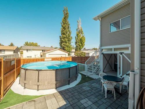 249 Greenwood Road, Coalhurst, AB - Outdoor With Above Ground Pool With Exterior