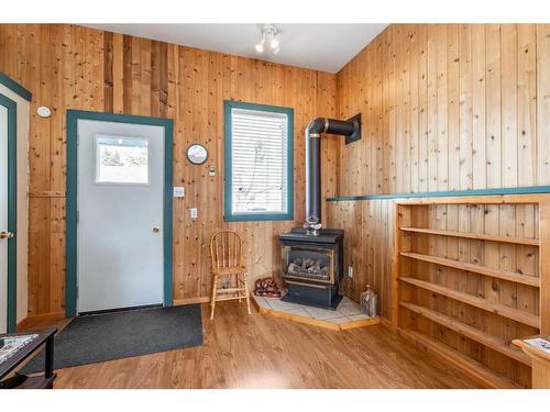 119 Milnes Street, Nobleford, AB - Indoor Photo Showing Other Room With Fireplace