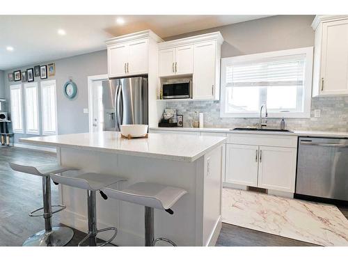 50 Stonegate Village East, Raymond, AB - Indoor Photo Showing Kitchen With Stainless Steel Kitchen With Upgraded Kitchen