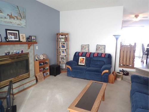 4505 Haven Place, Taber, AB - Indoor Photo Showing Living Room With Fireplace