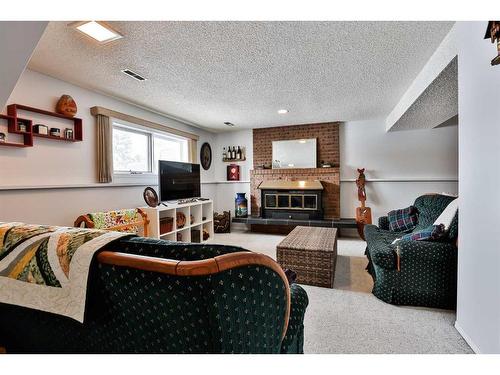 4603 55 Avenue, Taber, AB - Indoor Photo Showing Other Room With Fireplace