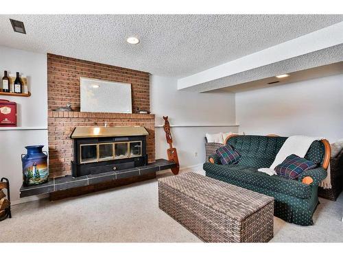 4603 55 Avenue, Taber, AB - Indoor Photo Showing Living Room With Fireplace