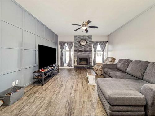 194 Eagle Rd North, Lethbridge, AB - Indoor Photo Showing Living Room With Fireplace