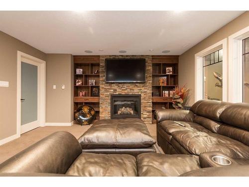 5023 43 Street, Taber, AB - Indoor Photo Showing Living Room With Fireplace