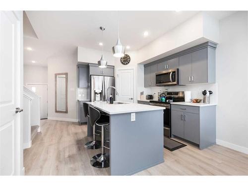 4-73 Aquitania Circle West, Lethbridge, AB - Indoor Photo Showing Kitchen With Upgraded Kitchen