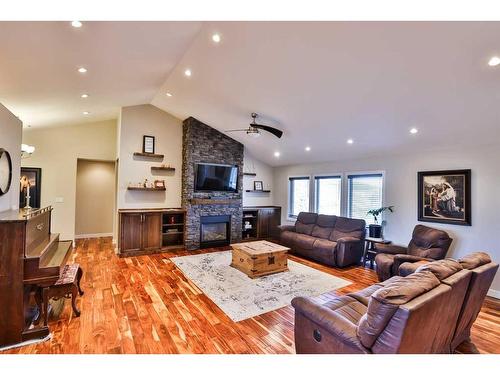 35 Church Avenue, Raymond, AB - Indoor Photo Showing Living Room With Fireplace