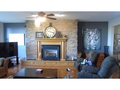 214 21 Street, Fort Macleod, AB - Indoor Photo Showing Living Room With Fireplace