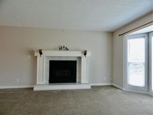11437 19 Avenue, Blairmore, AB - Indoor Photo Showing Living Room With Fireplace