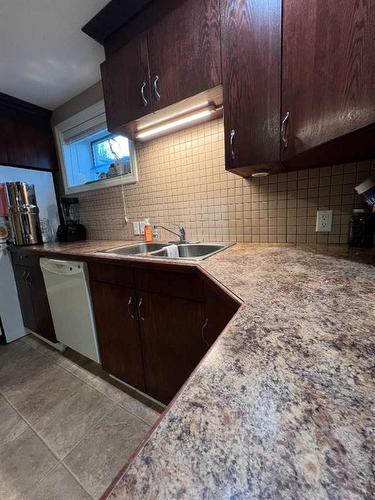 133 7 Street West, Cardston, AB - Indoor Photo Showing Kitchen With Double Sink