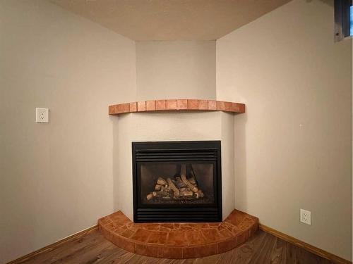 1519 16 Avenue South, Lethbridge, AB - Indoor Photo Showing Living Room With Fireplace