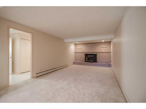 3906 Nipigon Road South, Lethbridge, AB - Indoor With Fireplace