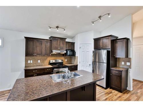 54 Sunridge Boulevard West, Lethbridge, AB - Indoor Photo Showing Kitchen With Stainless Steel Kitchen With Double Sink