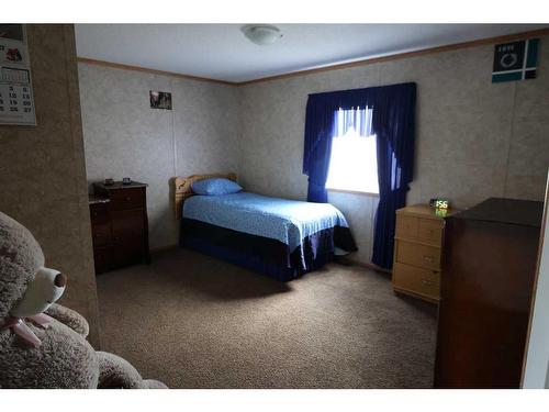 720 2 Street North, Grassy Lake, AB - Indoor Photo Showing Bedroom