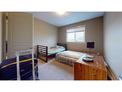 2-3918 Sundance Road South, Coalhurst, AB - Indoor Photo Showing Bedroom