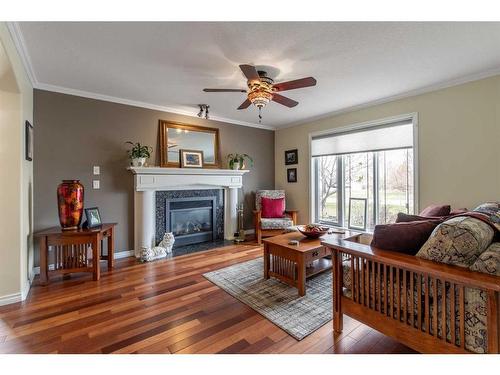 219 Falcon Ridge Way, Rural Lethbridge County, AB - Indoor Photo Showing Living Room With Fireplace