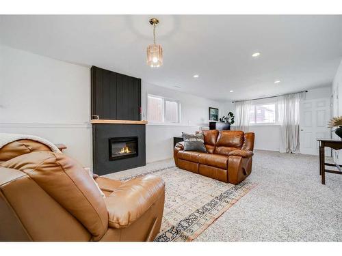 1026 Livingston Way, Pincher Creek, AB - Indoor Photo Showing Living Room With Fireplace