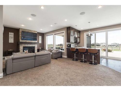 425 Arbourwood Terrace South, Lethbridge, AB - Indoor Photo Showing Living Room With Fireplace