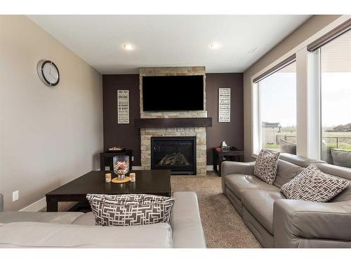 425 Arbourwood Terrace South, Lethbridge, AB - Indoor Photo Showing Living Room With Fireplace